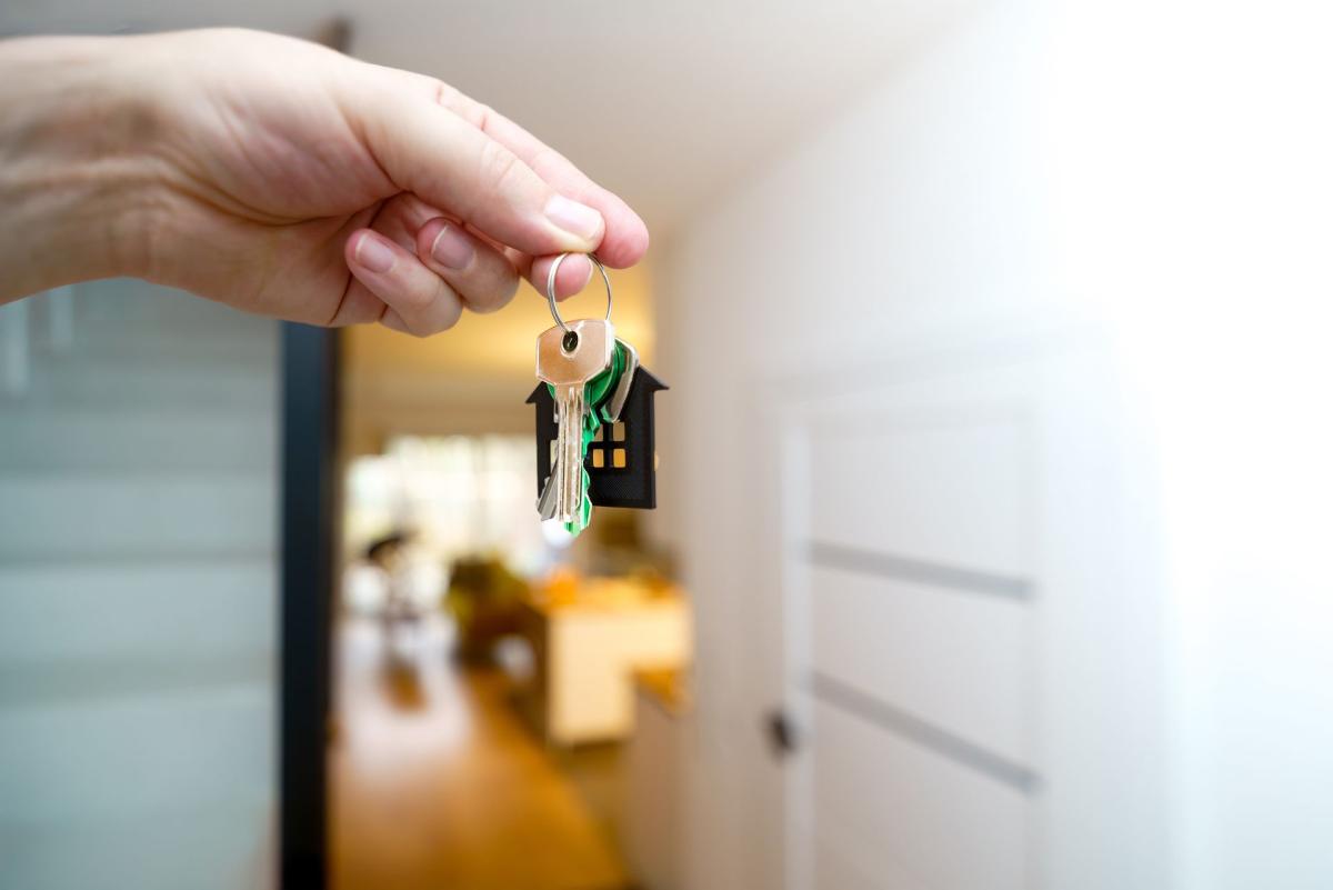 House keys handed over across a table